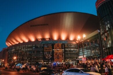 evening view of Bridgestone Arena lit-up outside in Nashville TN